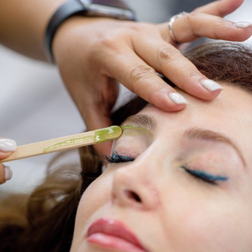 woman-getting-wax-on-her-eyebrows